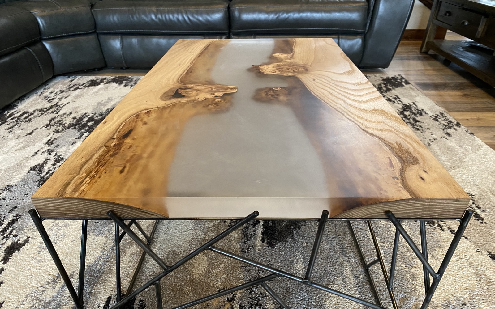 Finished arachno coffee table with walnut and epoxy top on brazed steel lattice base