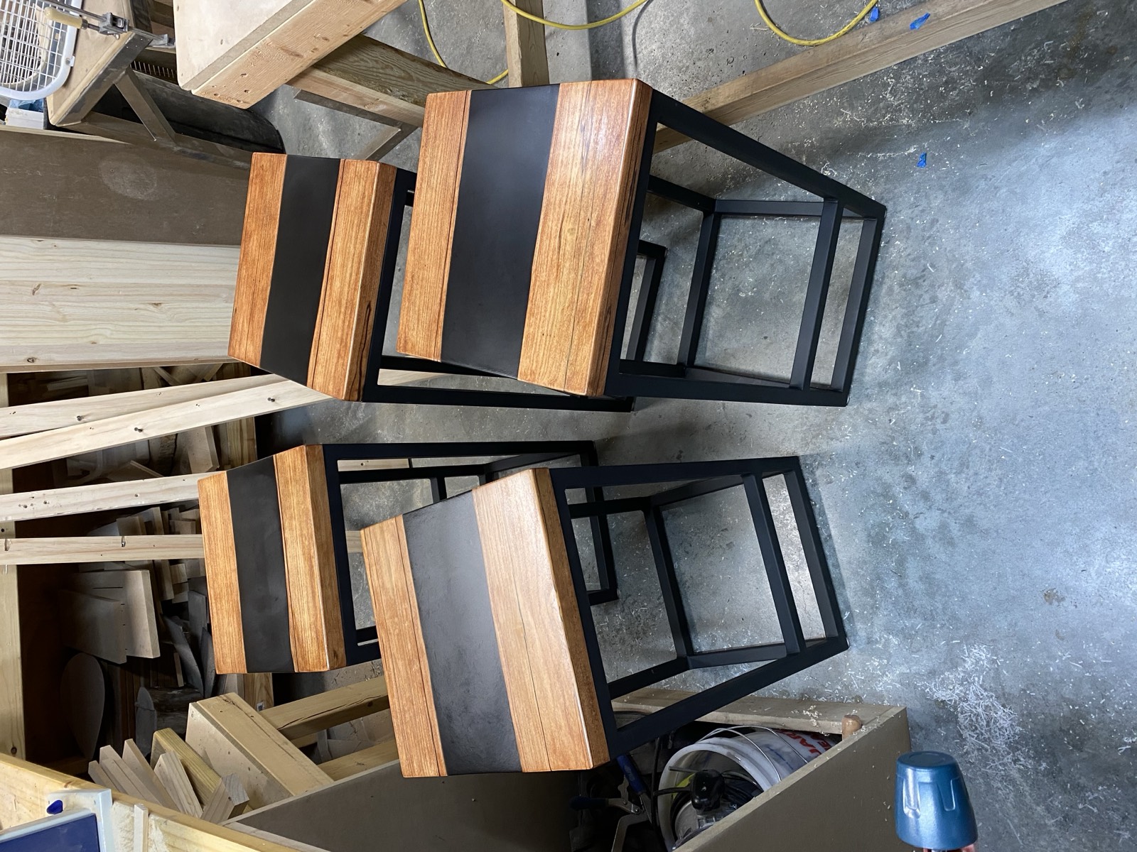 Bar stools in the workshop with epoxy river seats on welded frames