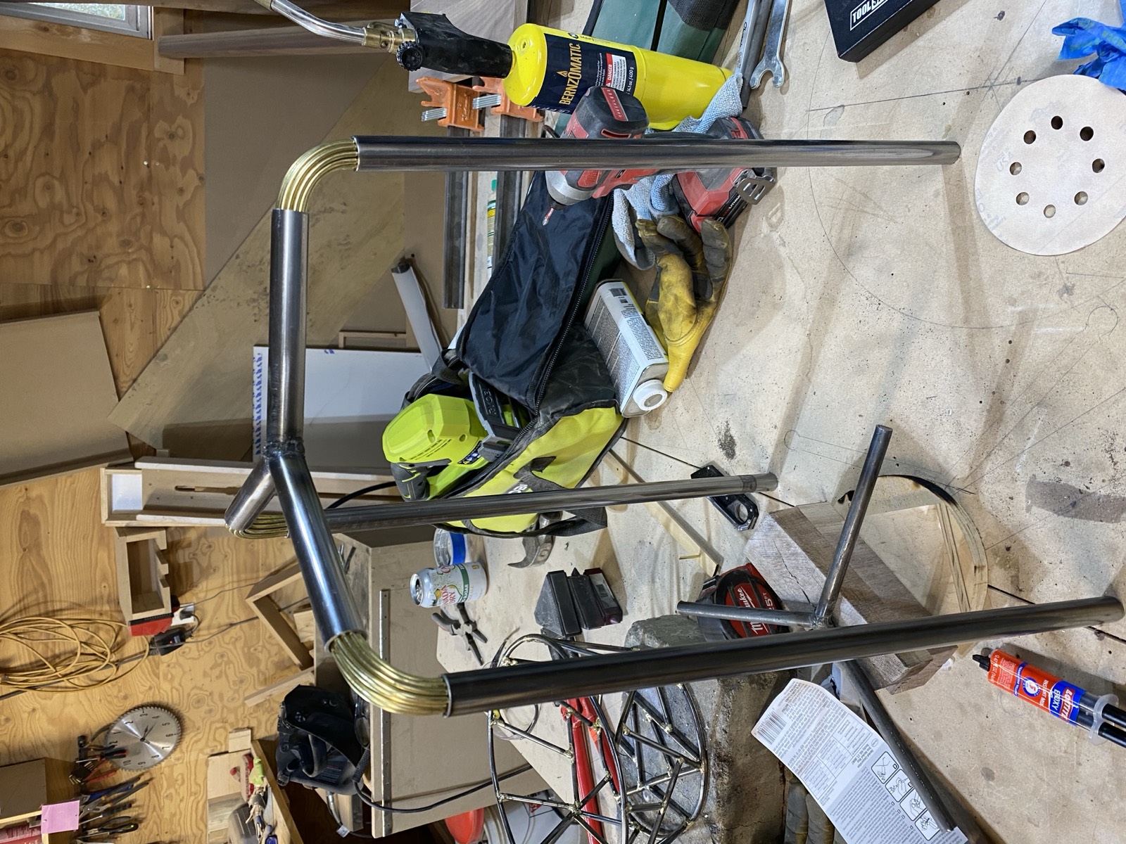 Steel tube frame in the workshop with brass rods bent around corners