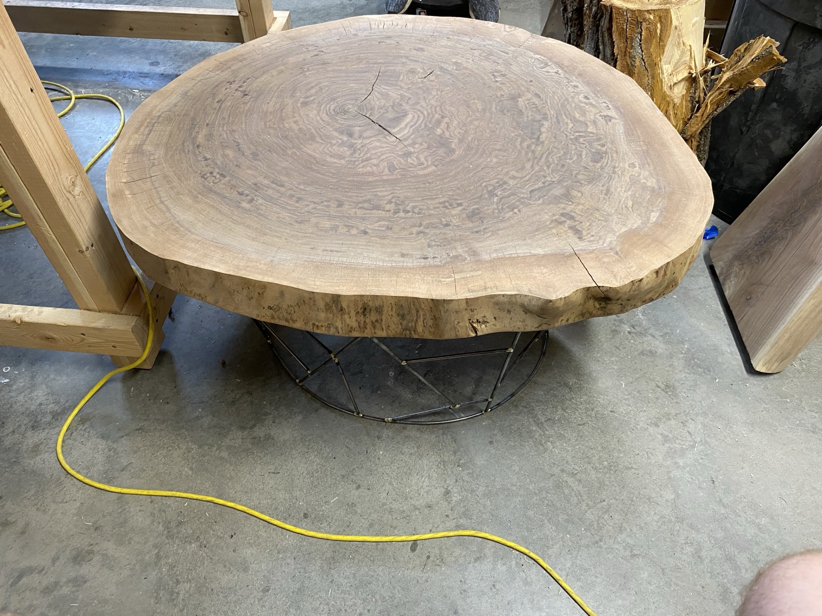 Top-angle view in the workshop showing the slab grain and base below
