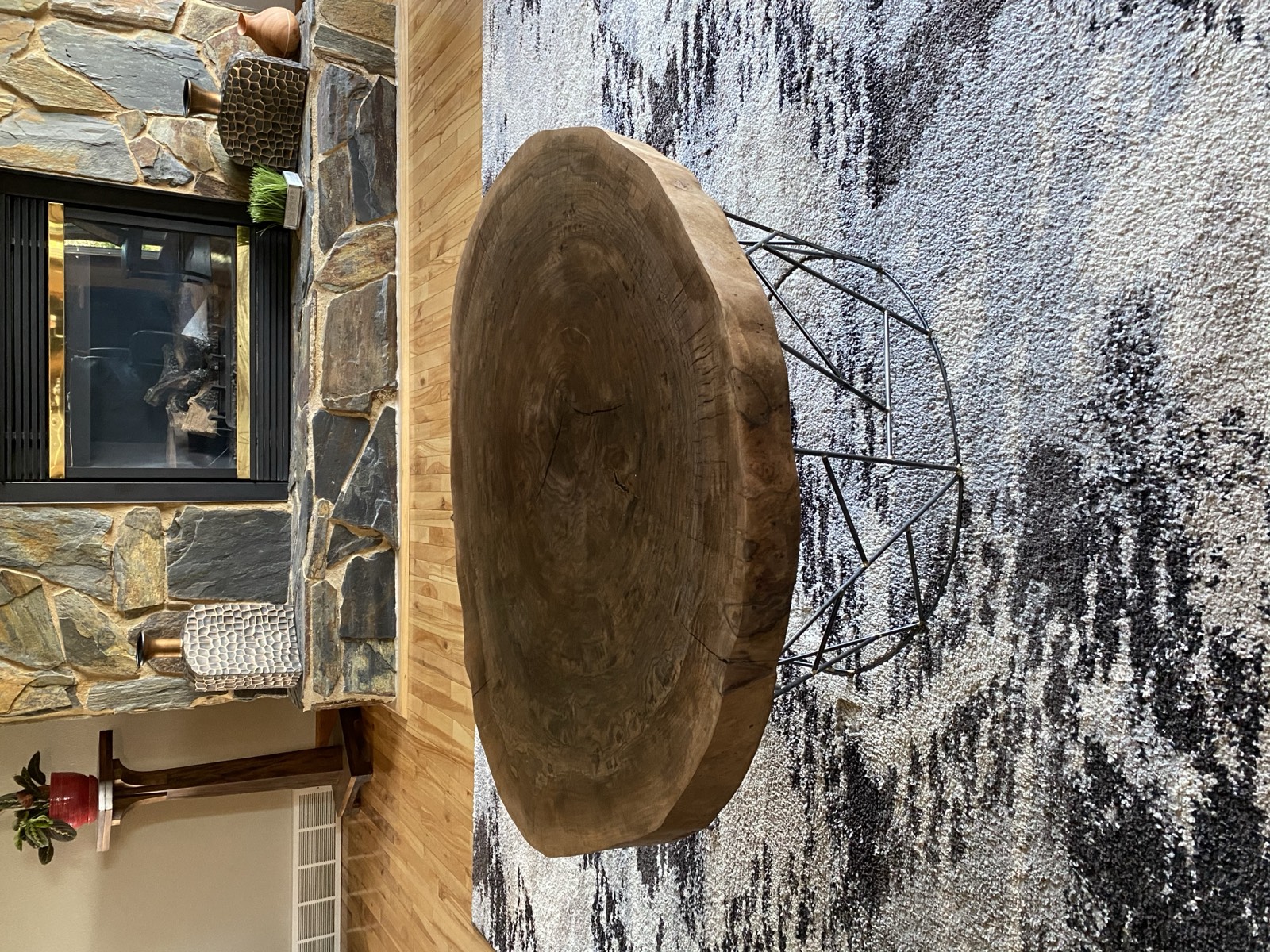 Finished table in the living room by the stone fireplace