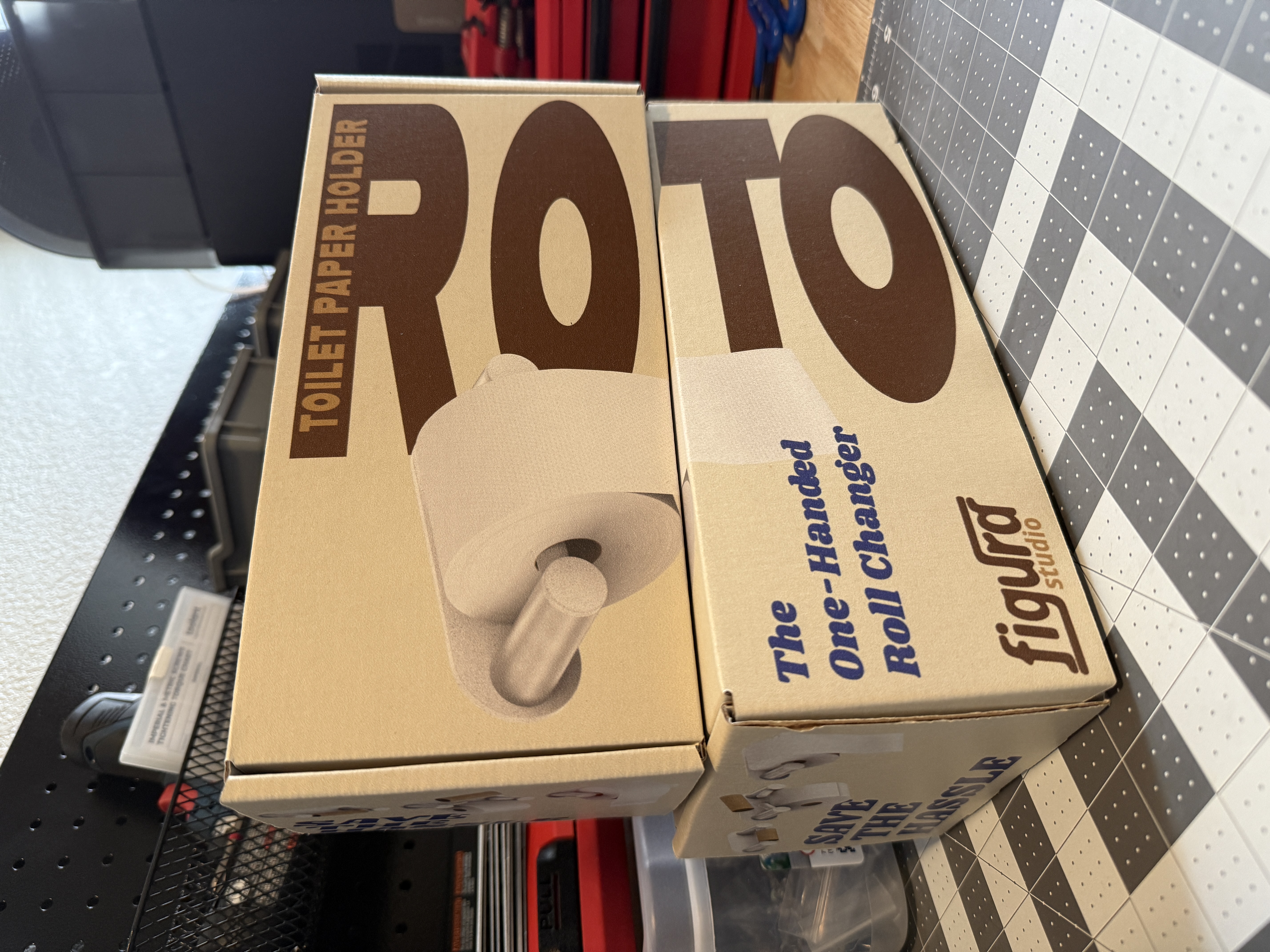 Early Figura Studio Roto packaging prototypes with logo, product mark, and one-handed changer messaging
