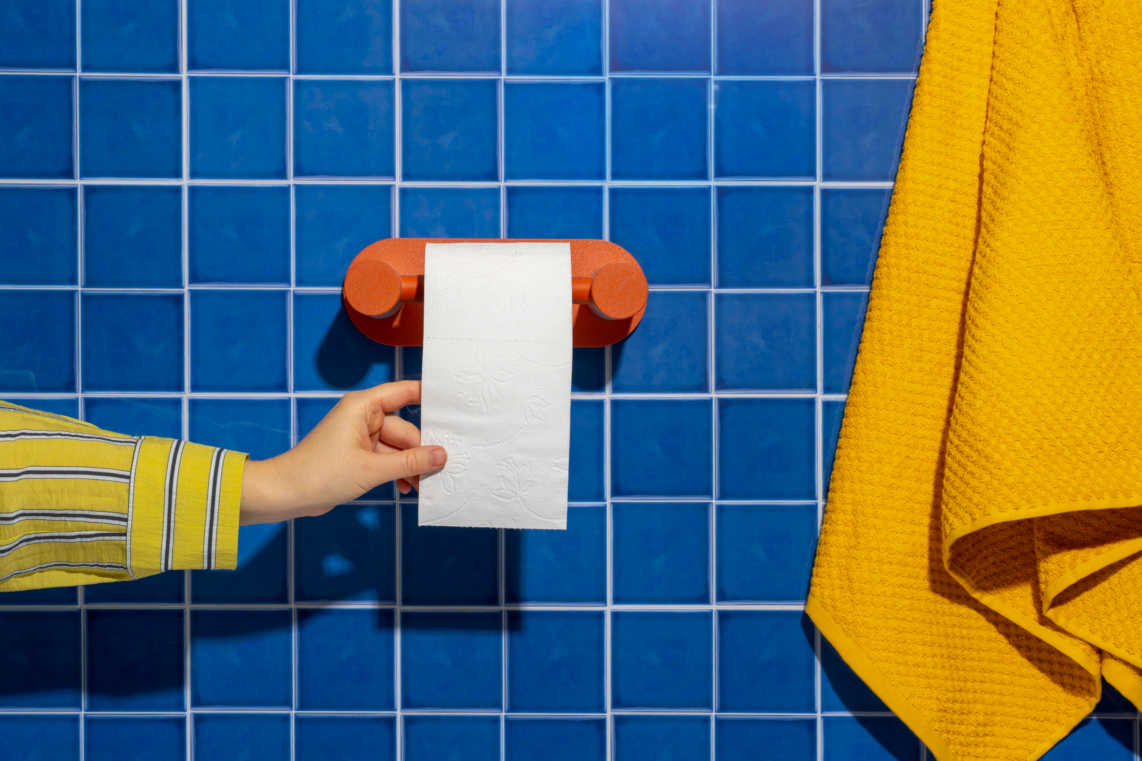 Figura Studio website product image showing the terracotta Roto mounted in a bathroom scene
