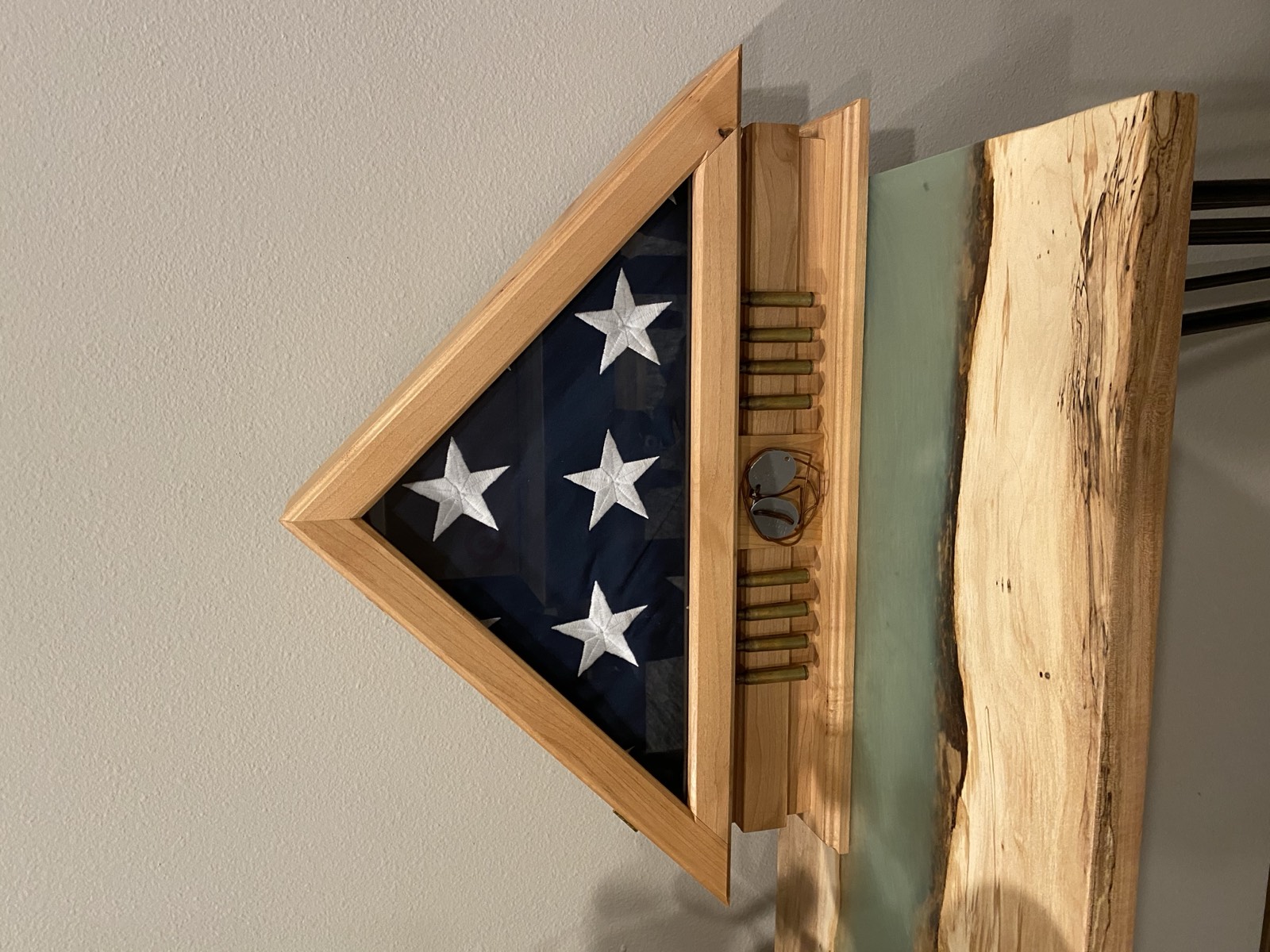 Finished memorial flag box with custom glass, bullet casings, and dog tags