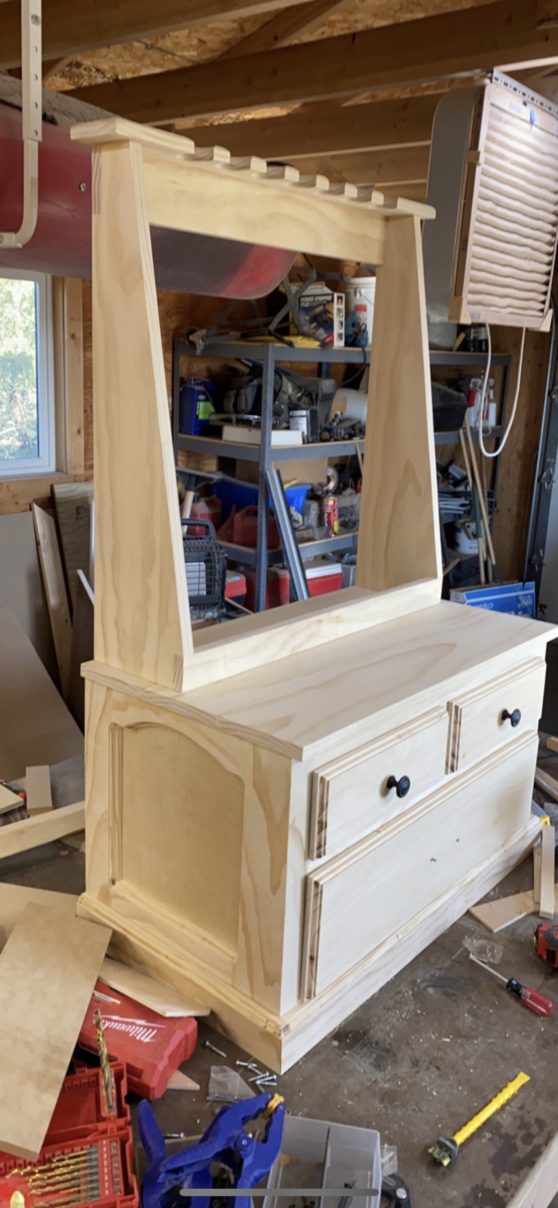 Unfinished gun cabinet in the workshop before staining