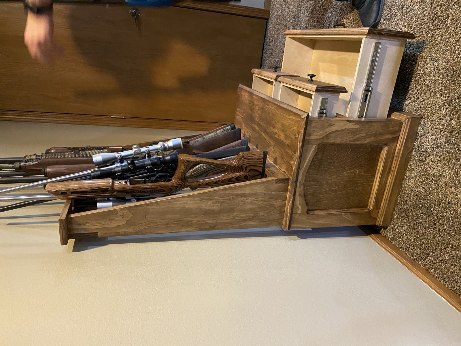 Finished cabinet from a wider angle with rifles loaded
