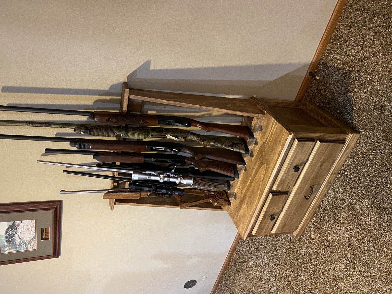 Finished gun cabinet loaded with rifles