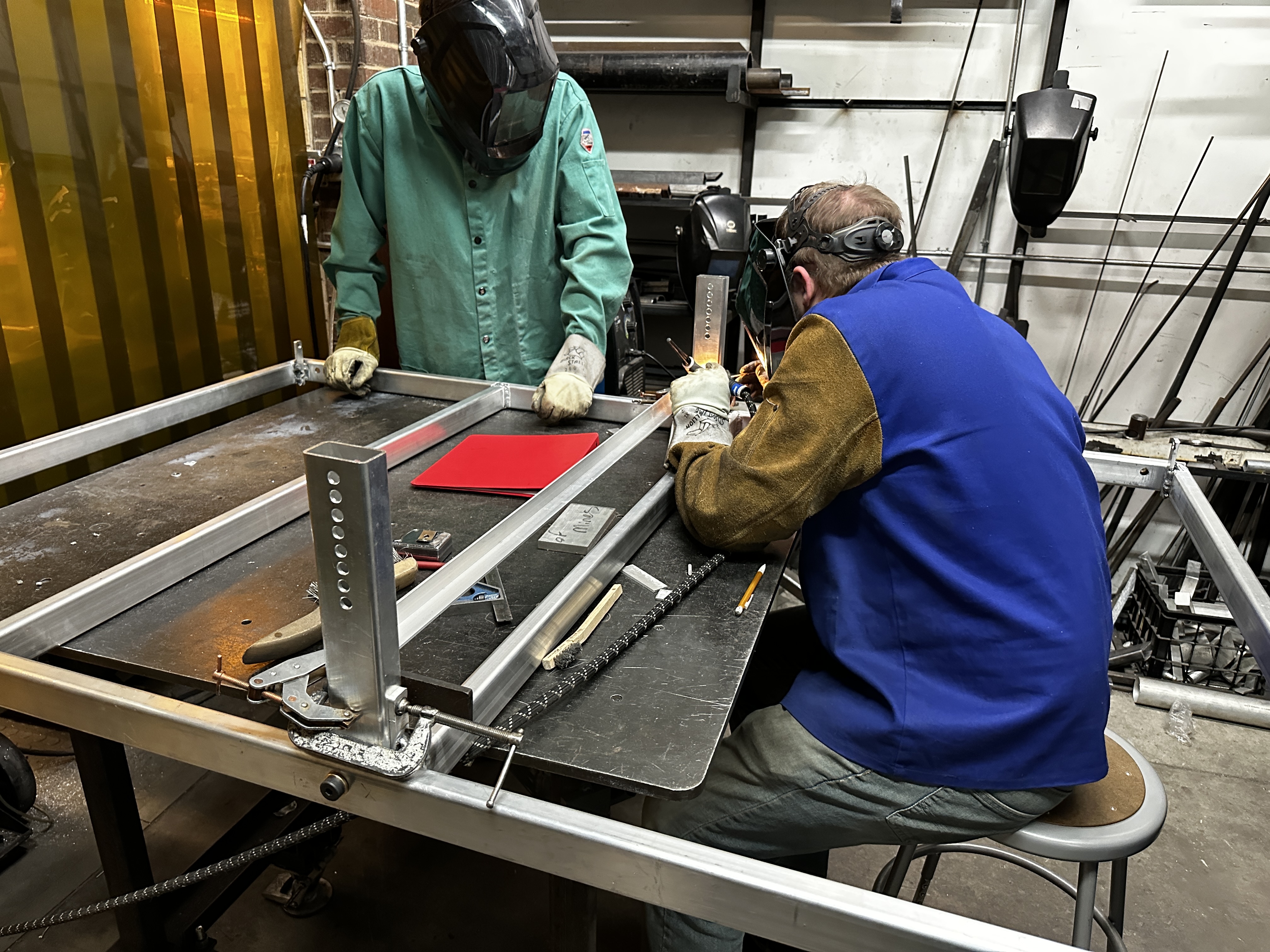 Welding the aluminum stage frame in the shop