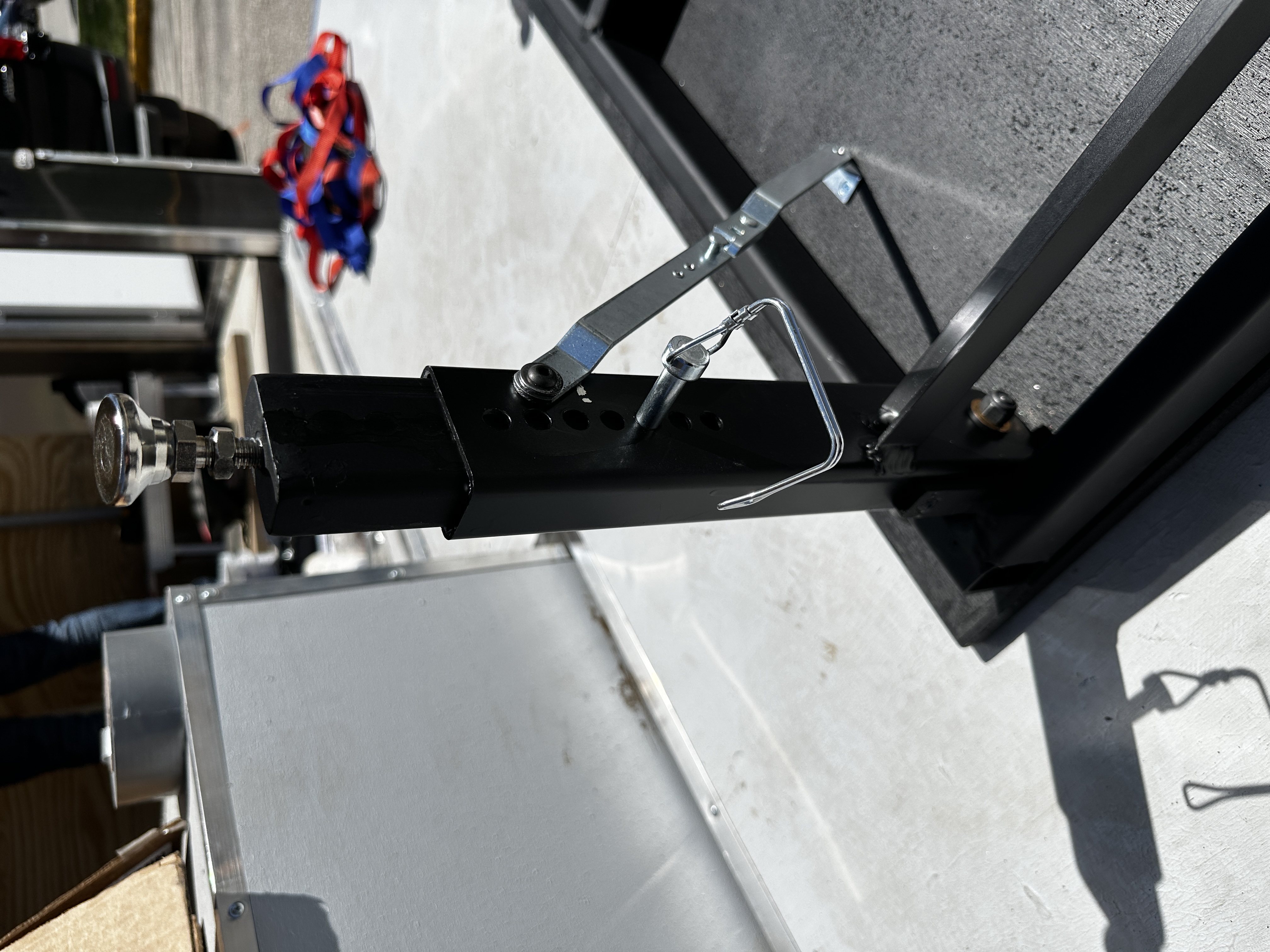 Close-up of the height-adjustable leg with cam lock handle installed on the stage frame