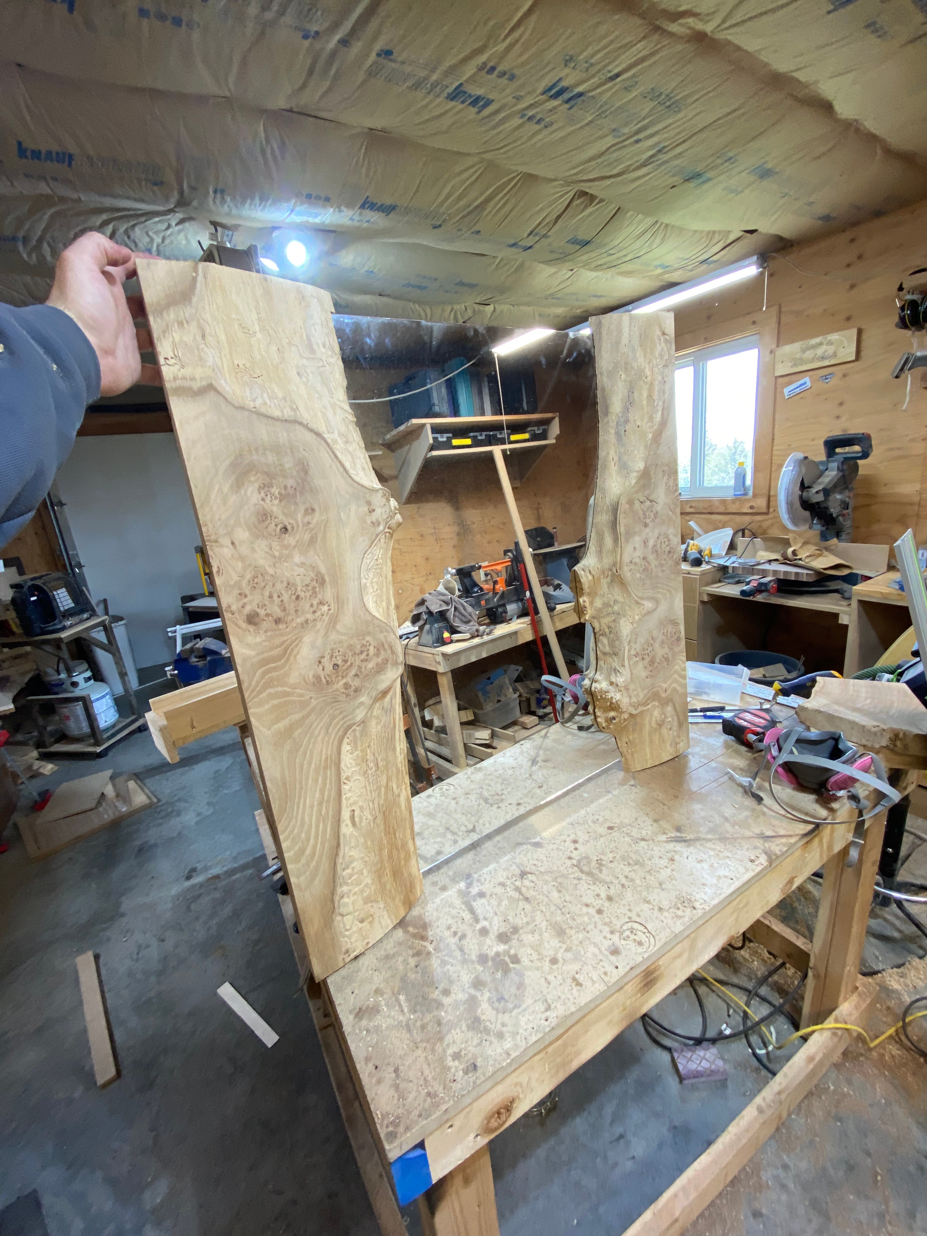 Raw birds-eye maple slab laid out in the workshop before cutting