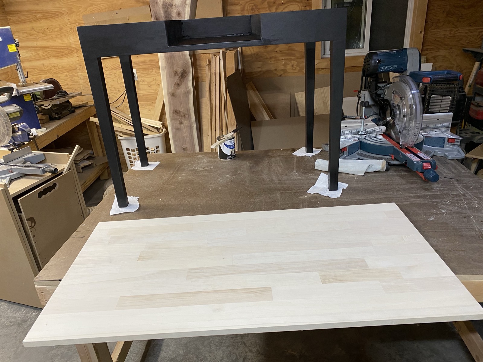 Painted frame with unfinished top panel ready for assembly