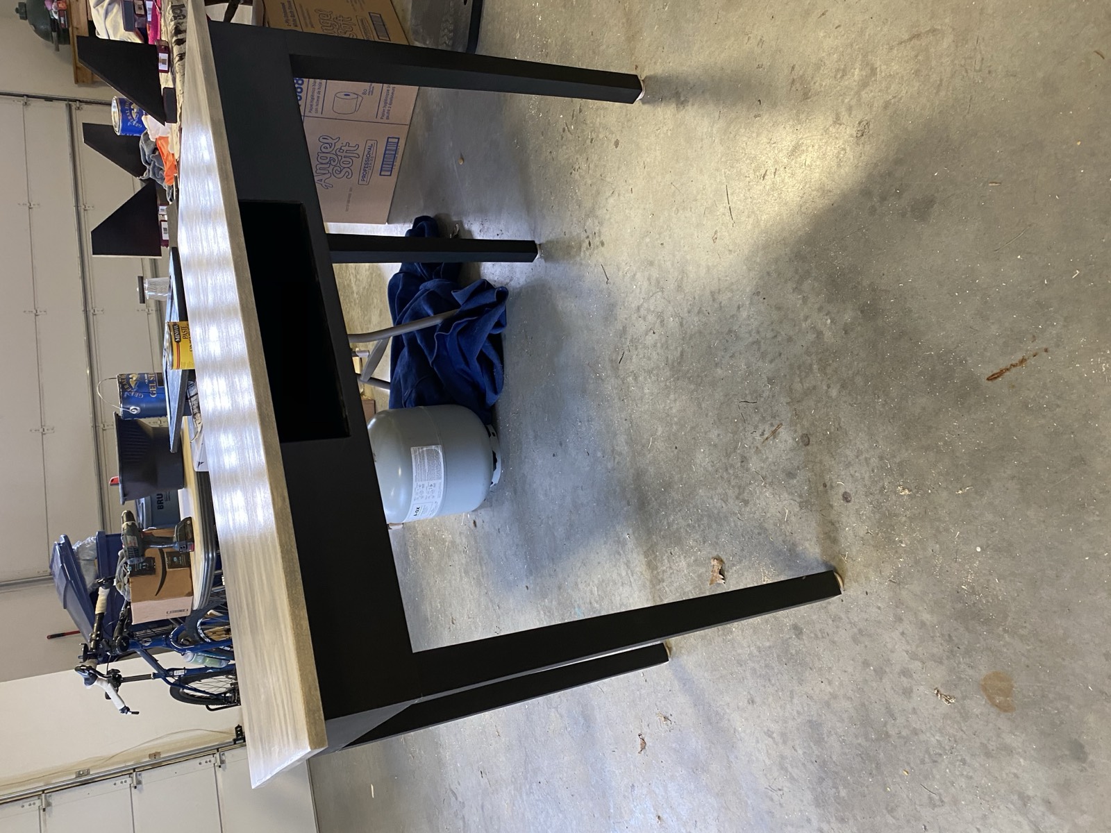 Assembled desk with top attached to painted frame