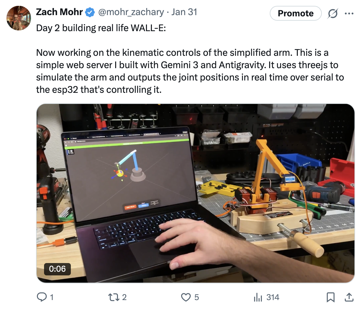 Day 2 post showing three.js arm simulator controlling a physical prototype
