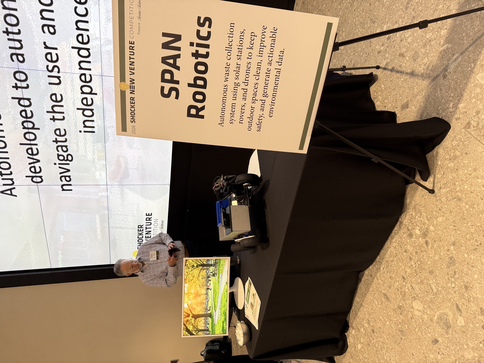 SPAN Robotics booth at the 2026 Shocker New Venture Competition with the robot prototype on display